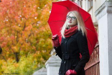 Woman with red travel umbrella